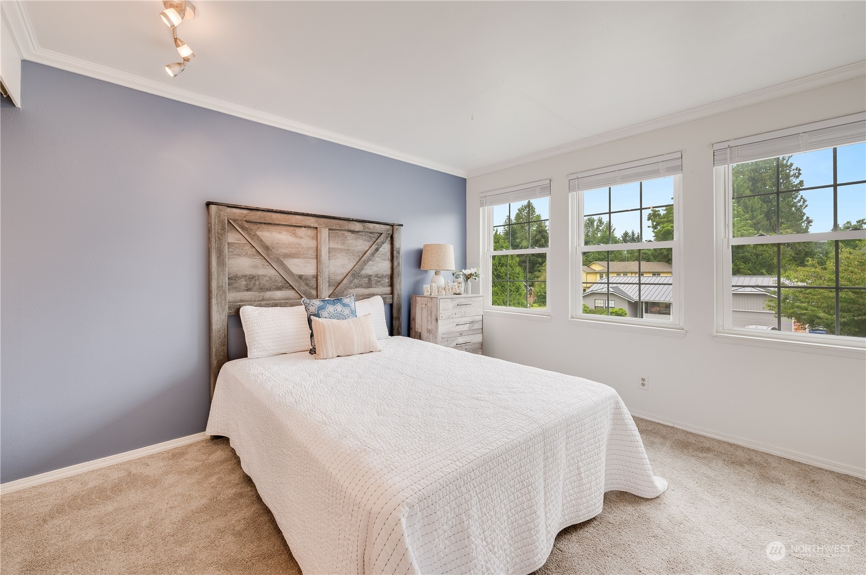 1816 243rd Place Southeast Bothell, WA 98021 - Photo 15 of 29 a bedroom with a large bed and a large window