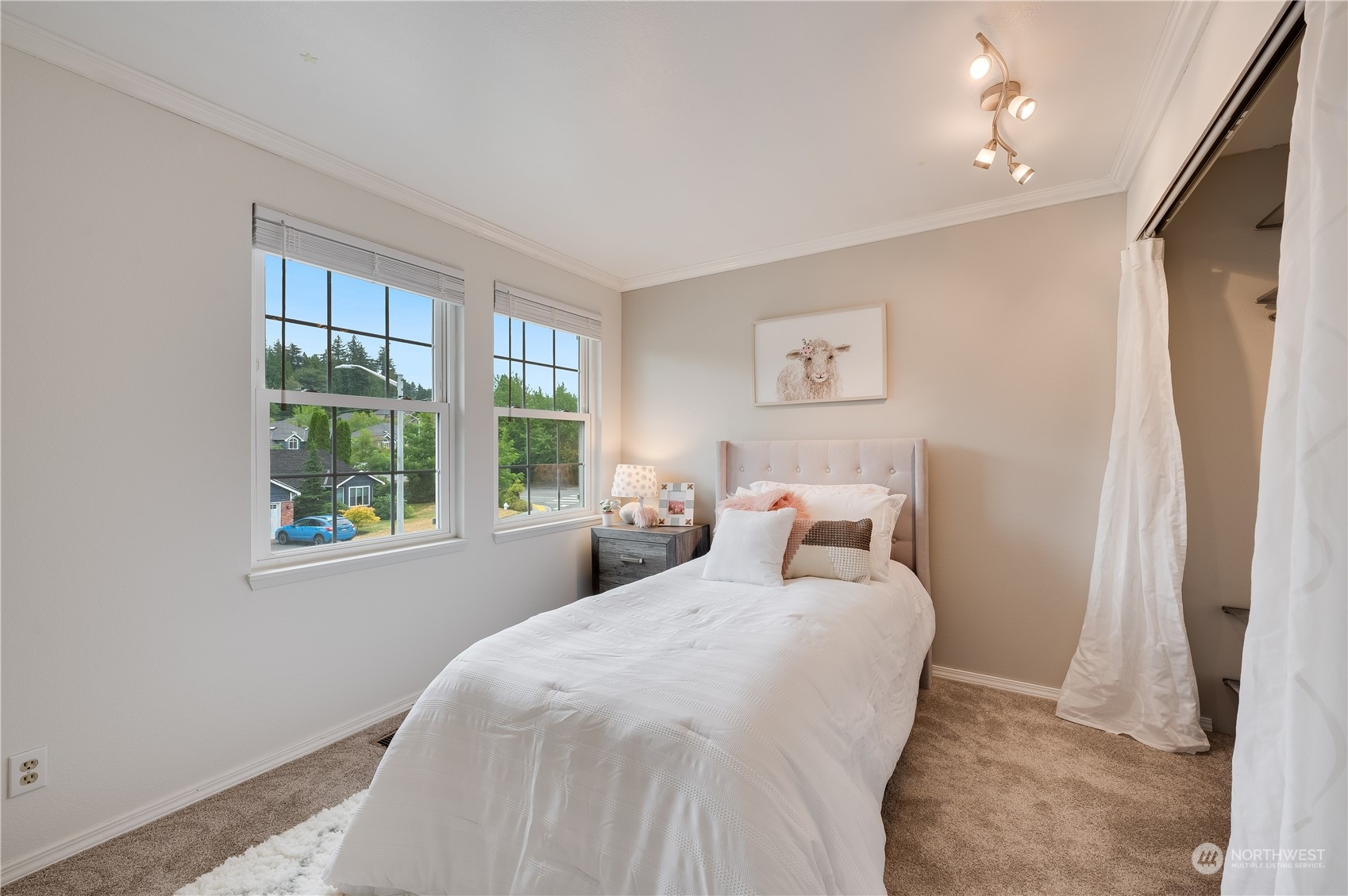 1816 243rd Place Southeast Bothell, WA 98021 - Photo 16 of 29 a bedroom with a bed and a large window