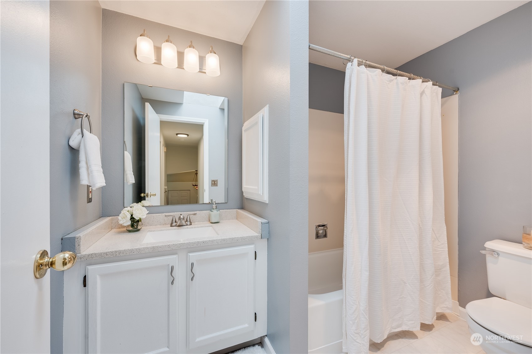 1816 243rd Place Southeast Bothell, WA 98021 - Photo 18 of 29 a bathroom with a sink a toilet and shower
