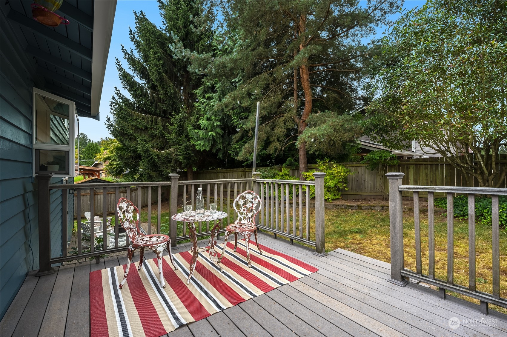 1816 243rd Place Southeast Bothell, WA 98021 - Photo 22 of 29 a view of balcony with wooden floor and outdoor seating