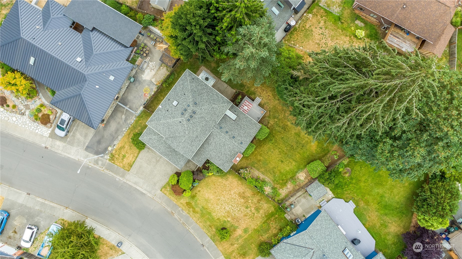 1816 243rd Place Southeast Bothell, WA 98021 - Photo 29 of 29 an aerial view of a house with swimming pool
