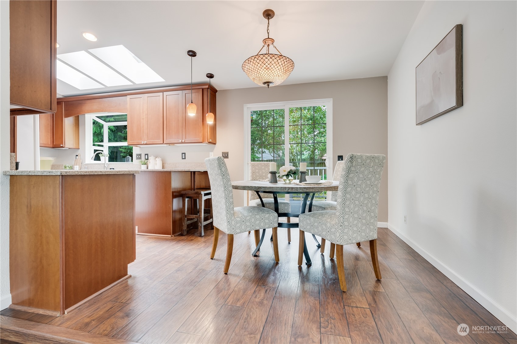 1816 243rd Place Southeast Bothell, WA 98021 - Photo 6 of 29 a dining room with furniture window wooden floor