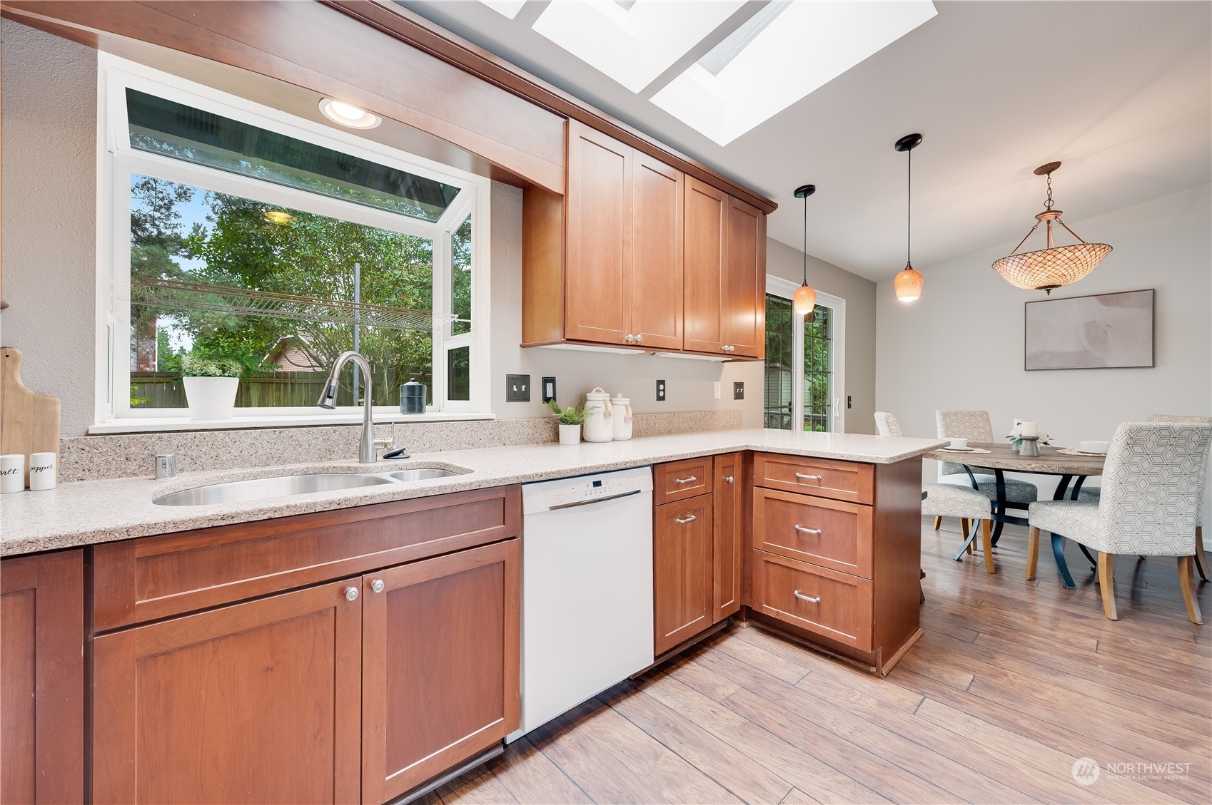 1816 243rd Place Southeast Bothell, WA 98021 - Photo 9 of 29 a kitchen with a sink cabinets and window
