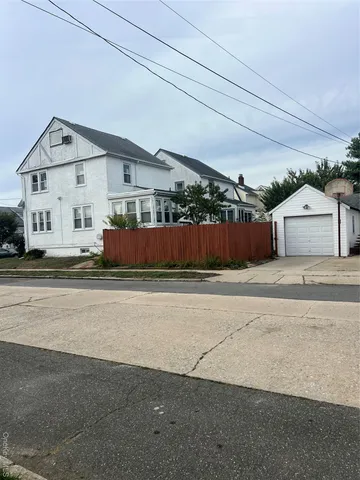 a view of a car in front of a house