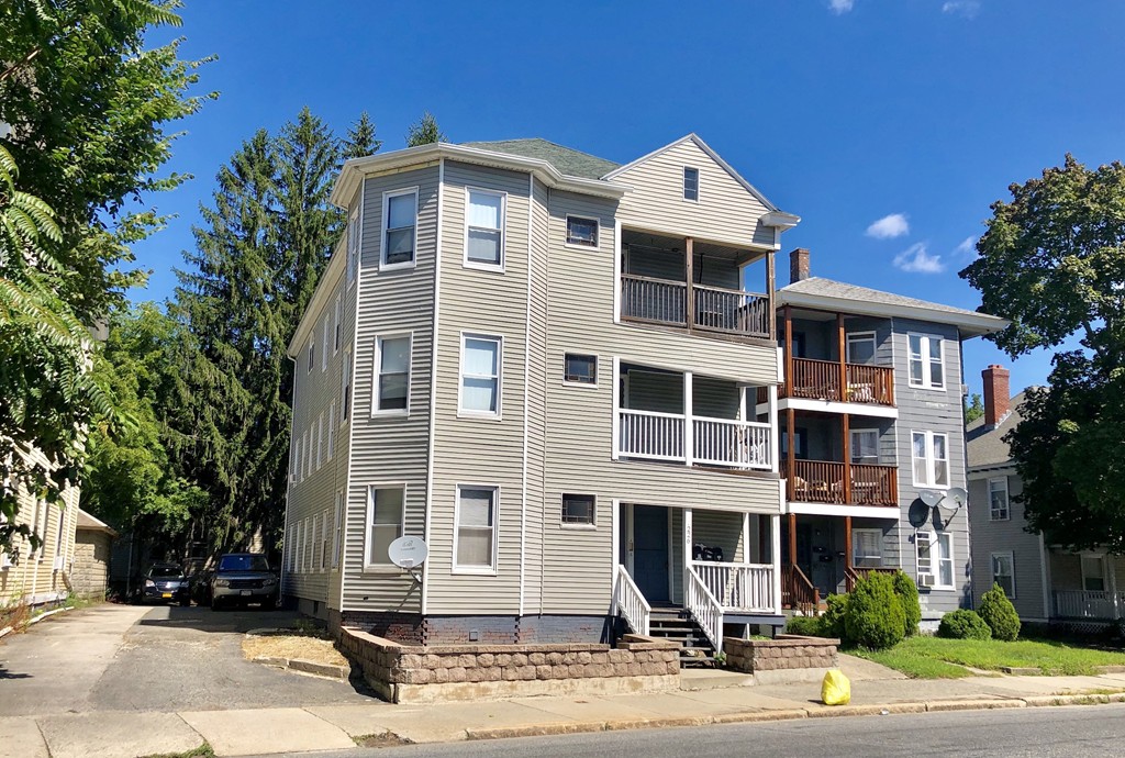 226 Highland Street Worcester, MA 01609 - Photo 1 of 28 a front view of a house with street