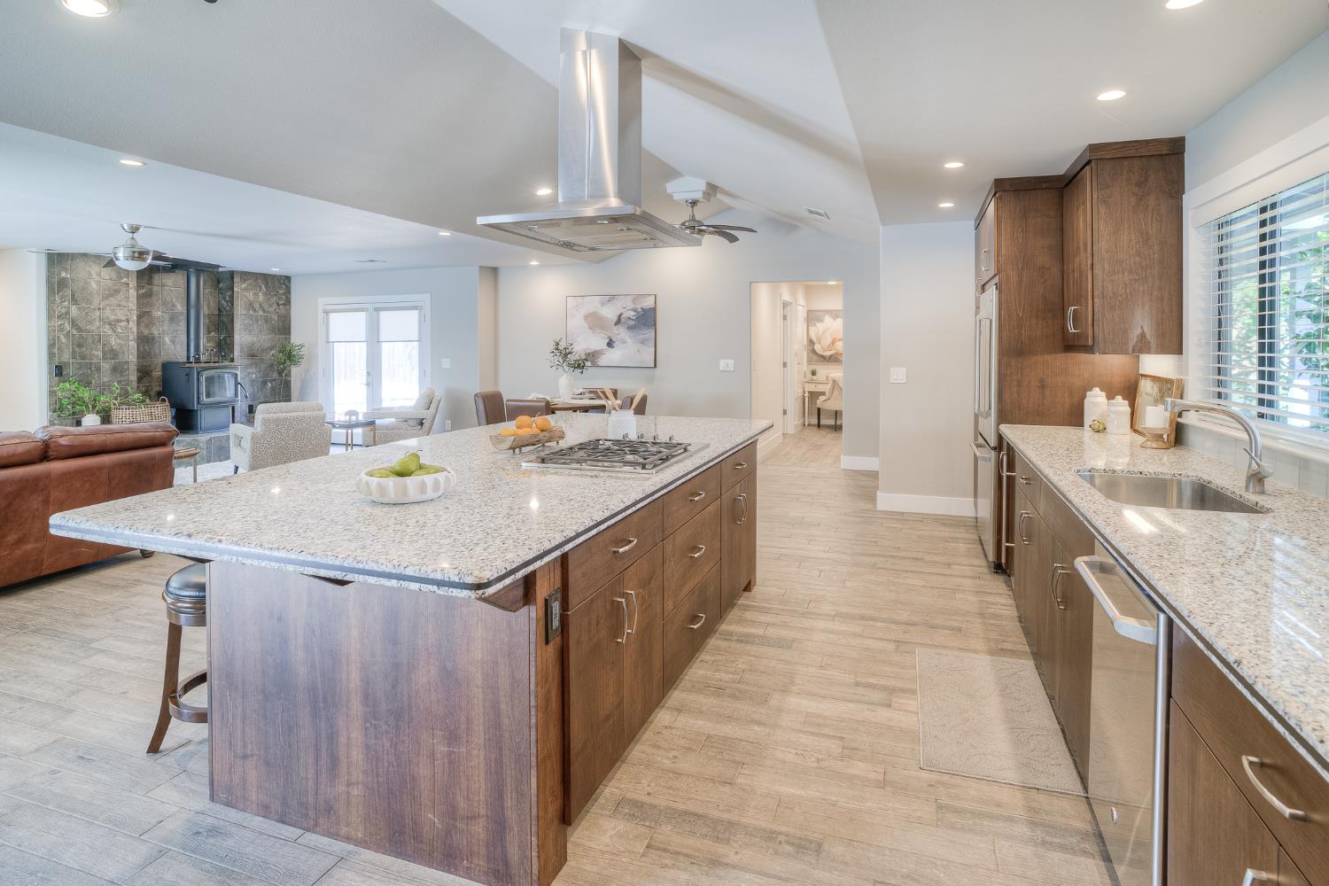 800 South Meridian Road Meridian, CA 95957 - Photo 17 of 81 a large kitchen with kitchen island a stove a sink a dining table and chairs