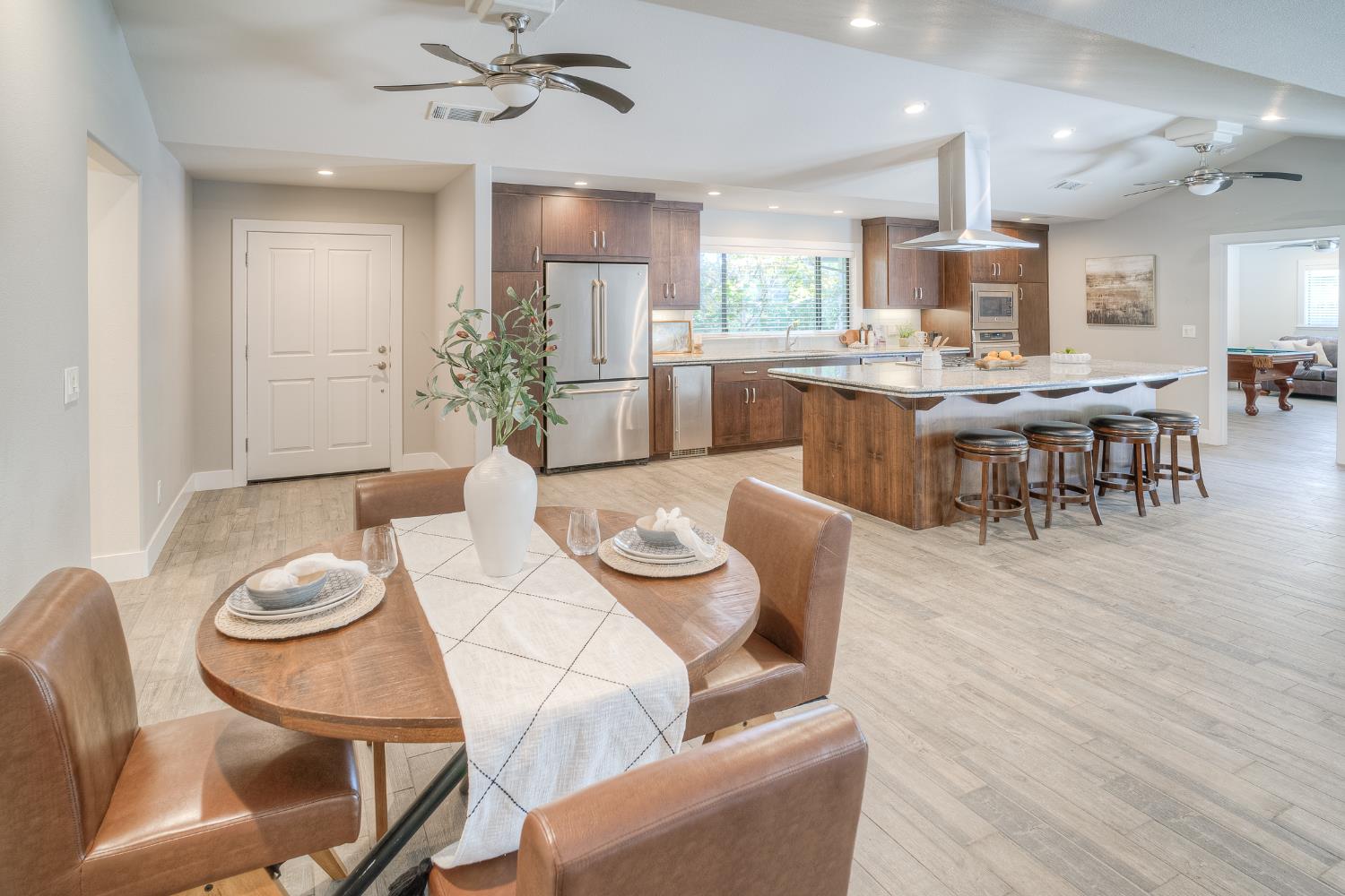 800 South Meridian Road Meridian, CA 95957 - Photo 19 of 81 a living room with furniture kitchen view and a wooden floor