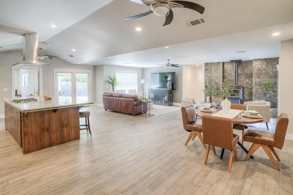 a living room with furniture and a potted plant