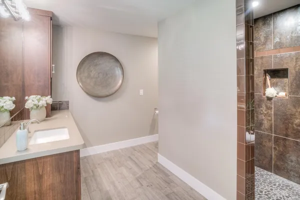 a bathroom with a shower and a tub