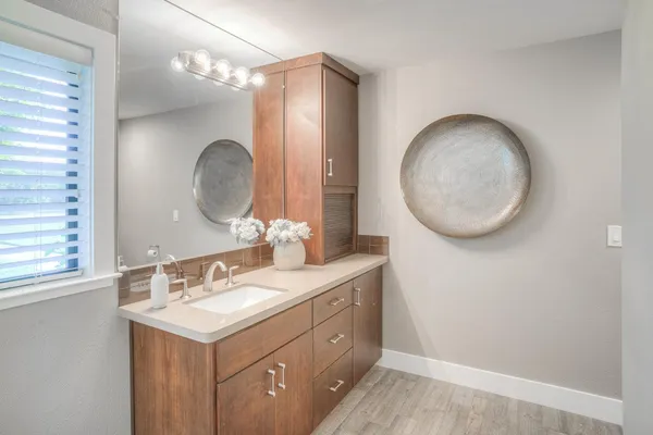 a bathroom with a sink and a mirror