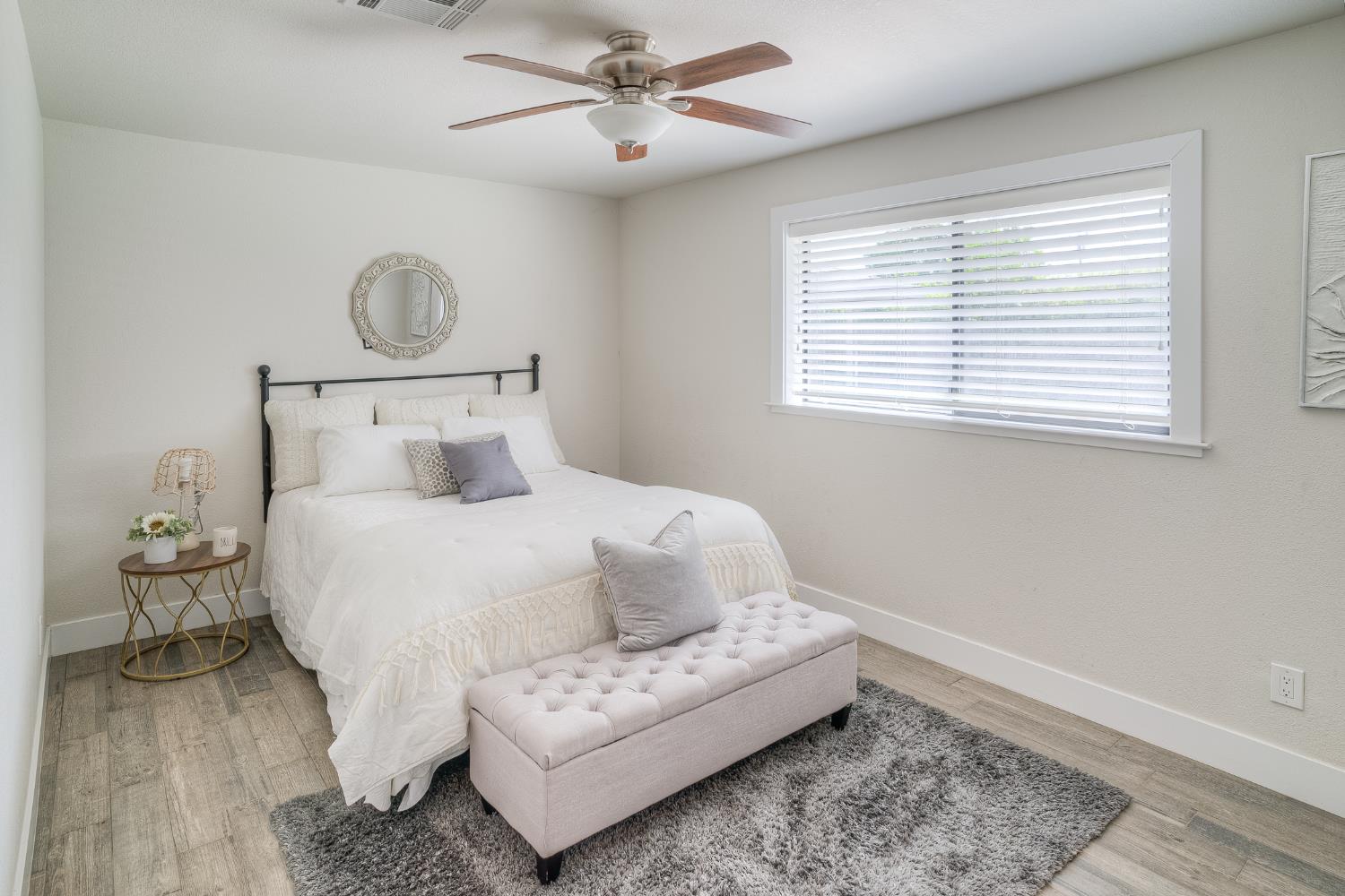800 South Meridian Road Meridian, CA 95957 - Photo 44 of 81 a bedroom with a bed and wooden floor