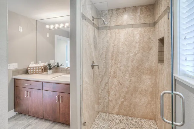 an aerial view of a house with a swimming pool