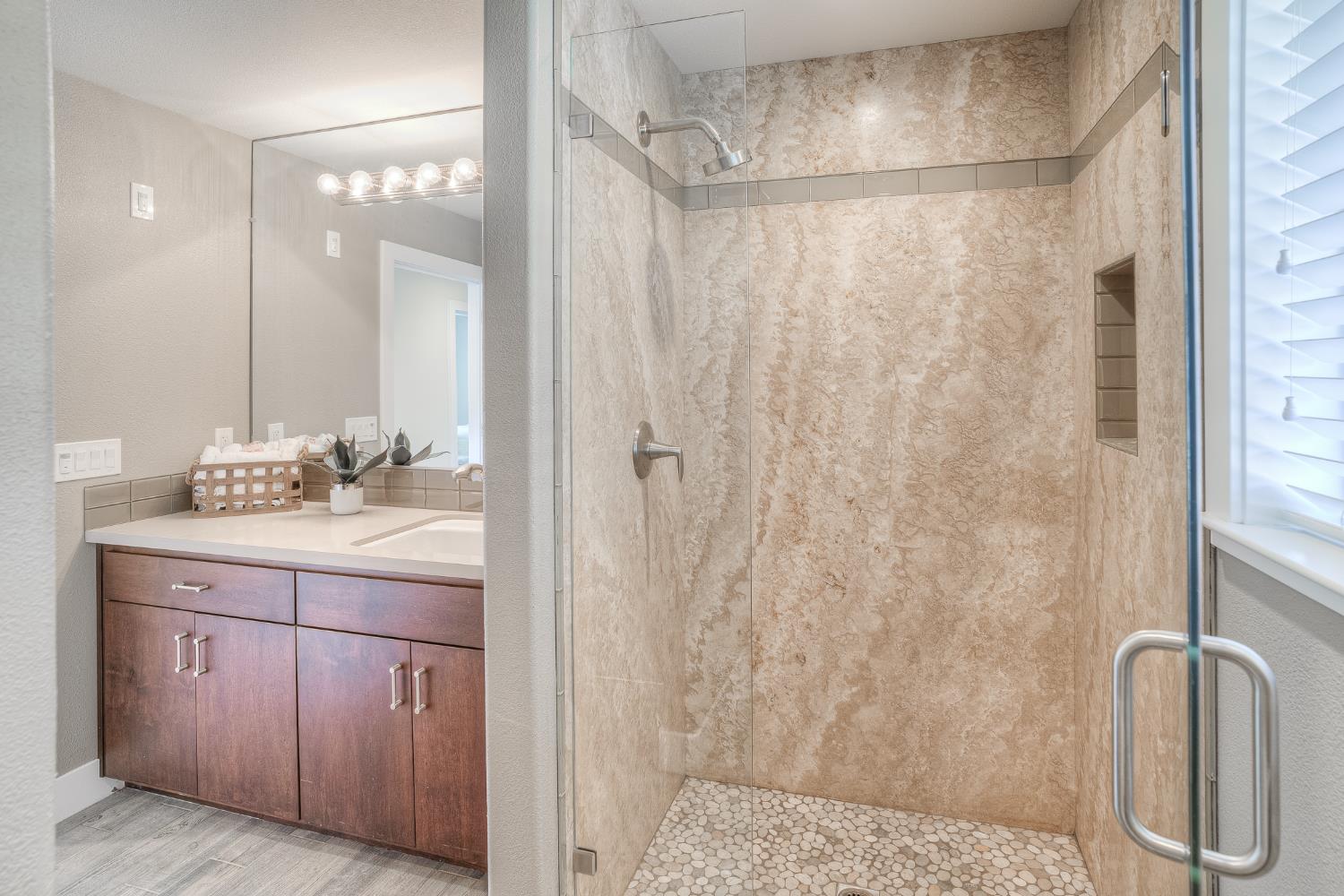 800 South Meridian Road Meridian, CA 95957 - Photo 49 of 81 a bathroom with a granite countertop sink a shower and a mirror