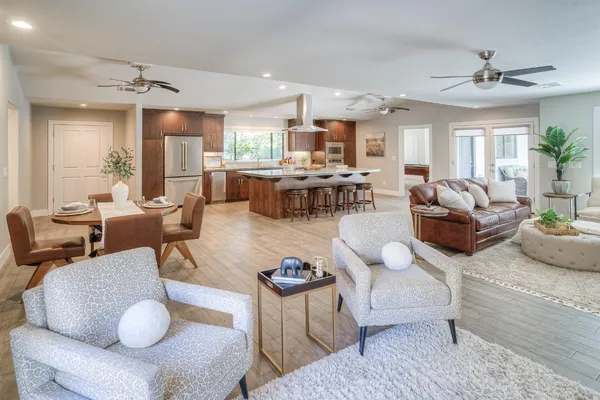 a kitchen with a sink appliances and cabinets
