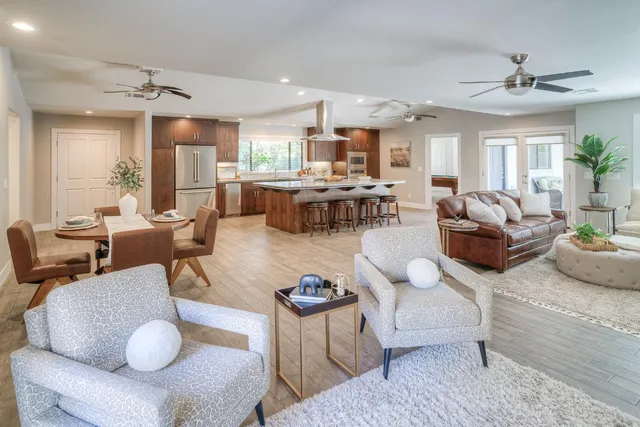 a kitchen with a sink appliances and cabinets