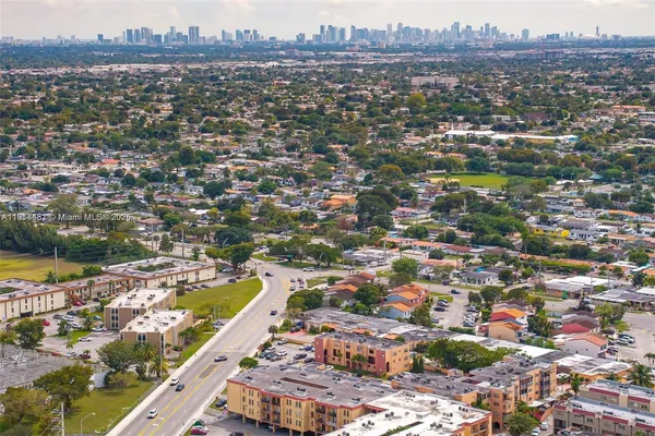 an aerial view of a city with lots of residential buildings