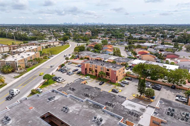 an aerial view of residential building and lake