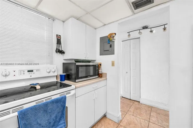 a kitchen with stainless steel appliances a stove and a refrigerator