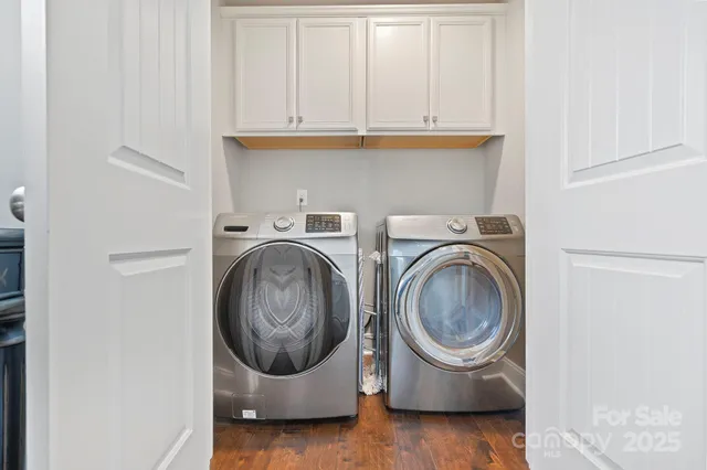 a utility room with sink dryer and washer