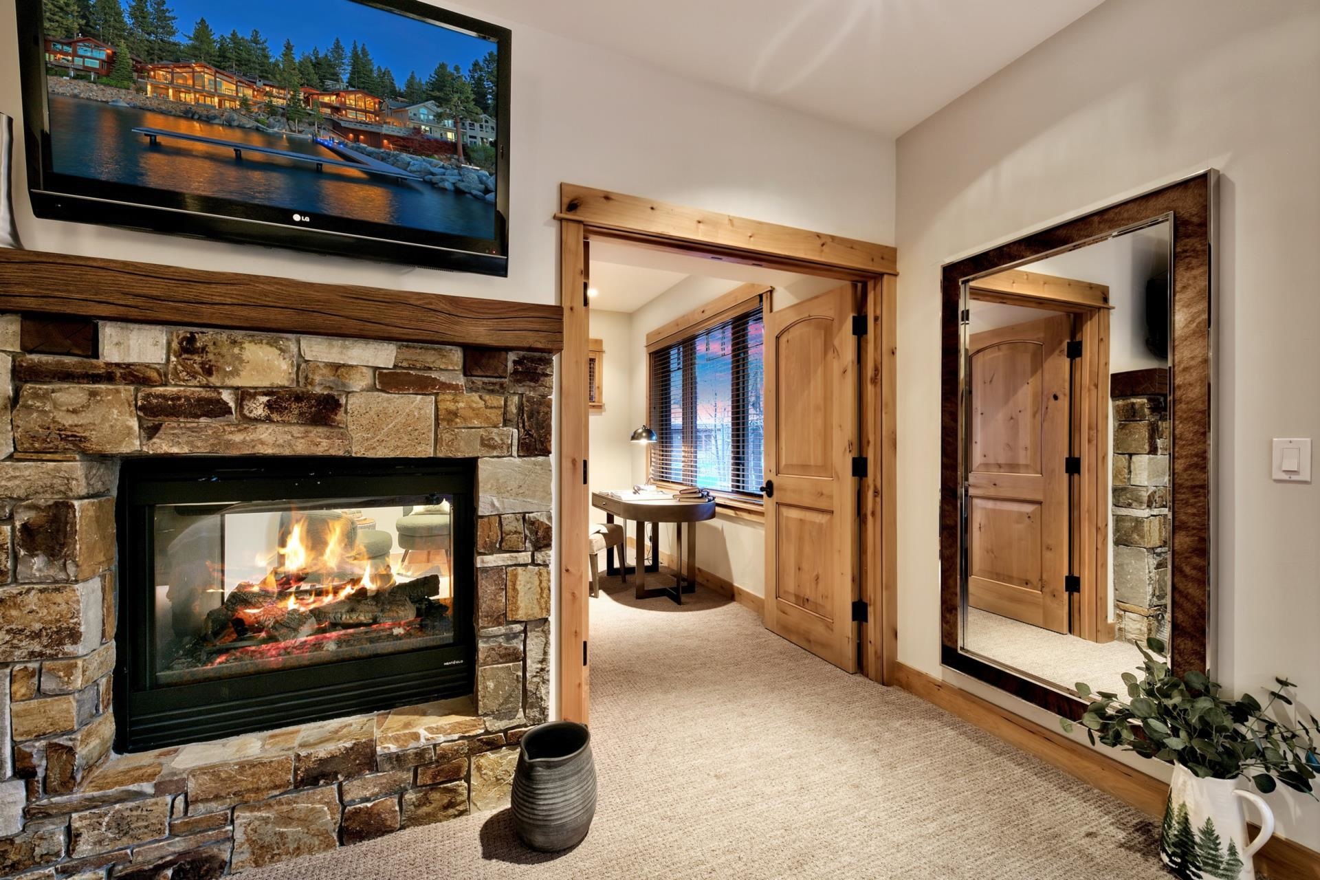 10239 Valmont Trail Truckee, CA 96161 - Photo 14 of 21 a living room with fireplace furniture and a flat screen tv
