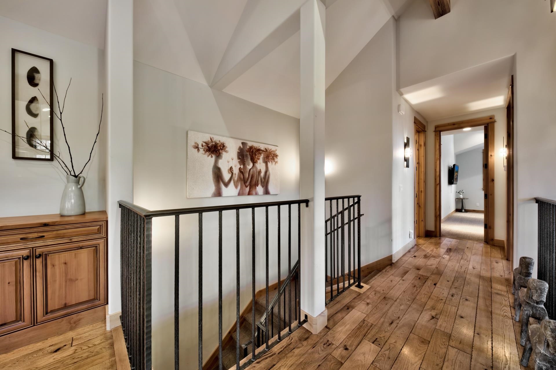 10239 Valmont Trail Truckee, CA 96161 - Photo 20 of 21 a view of a hallway with wooden floor and stairs