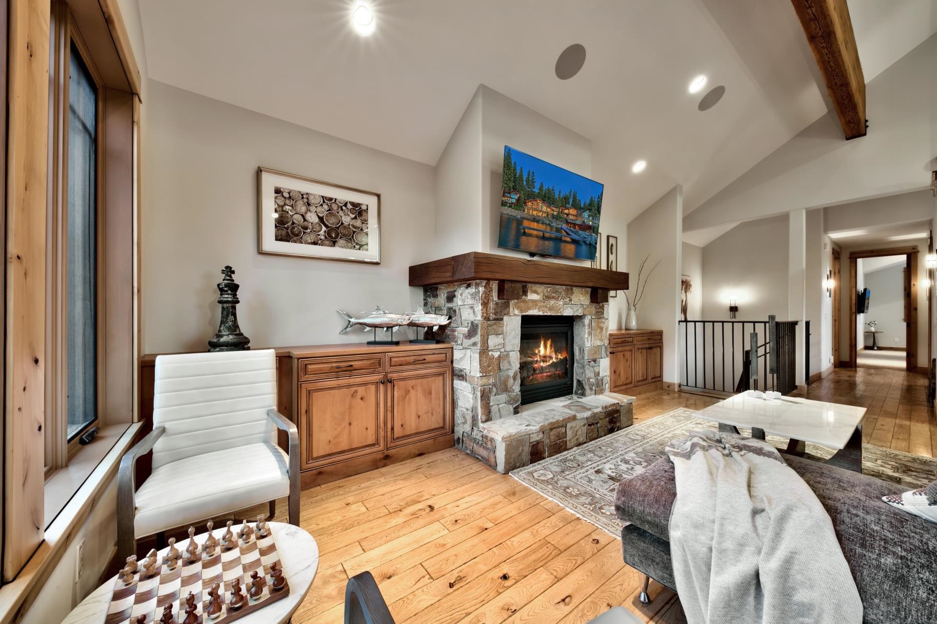 10239 Valmont Trail Truckee, CA 96161 - Photo 8 of 21 a bedroom with furniture and a fireplace