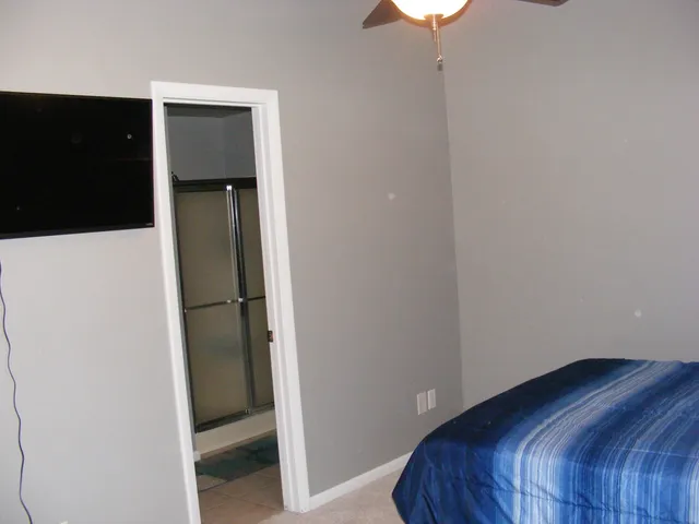 a bedroom with a bed and a closet