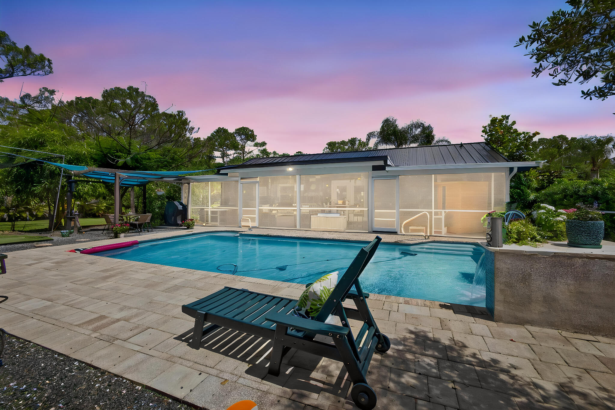 12558 165th Road North Jupiter, FL 33478 - Photo 46 of 67 a view of a chair and table on the terrace