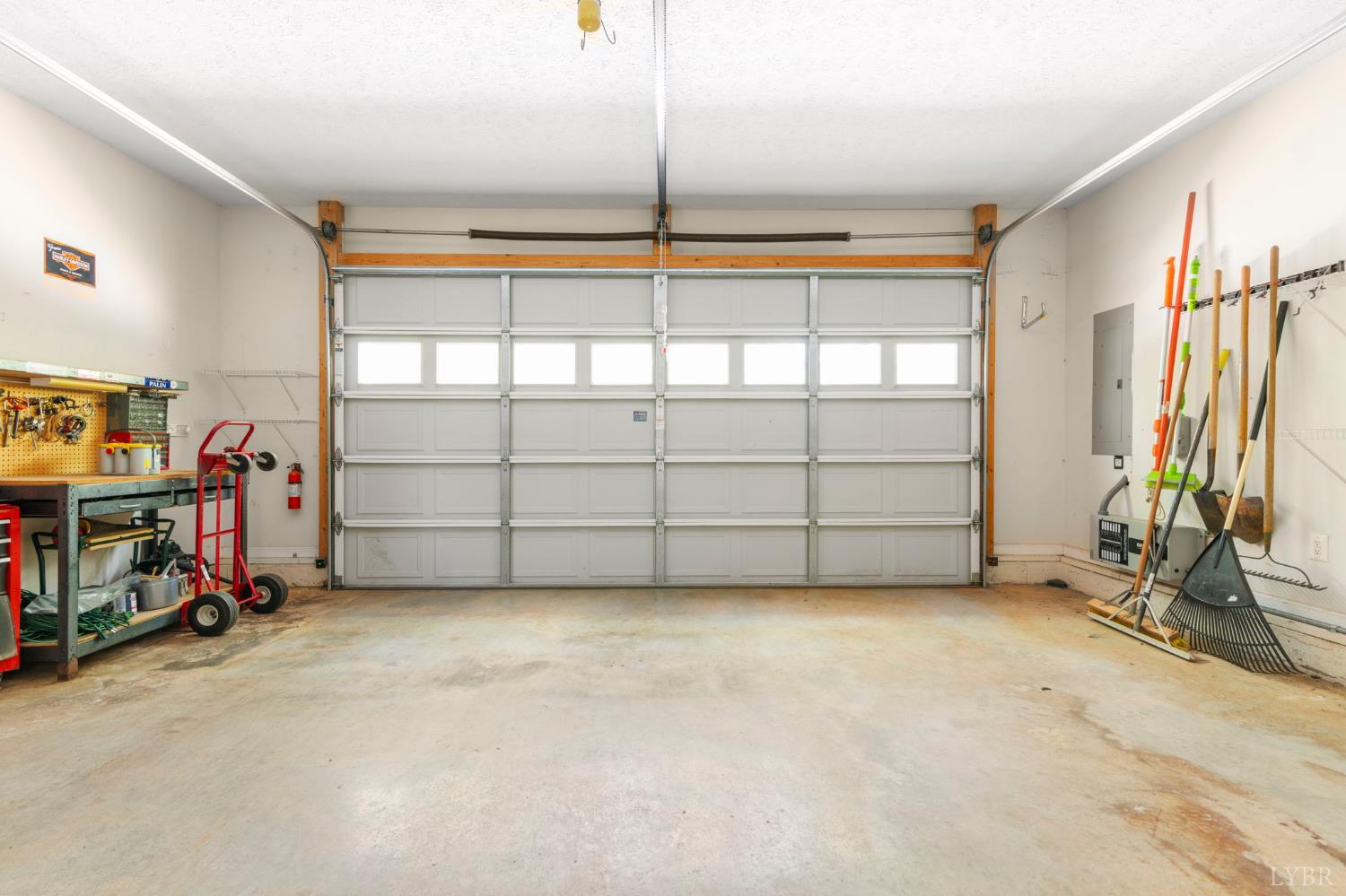 298 Braxton Ridge Road Amherst, VA 24521 - Photo 37 of 65 a view of a garage with rack and bicycle