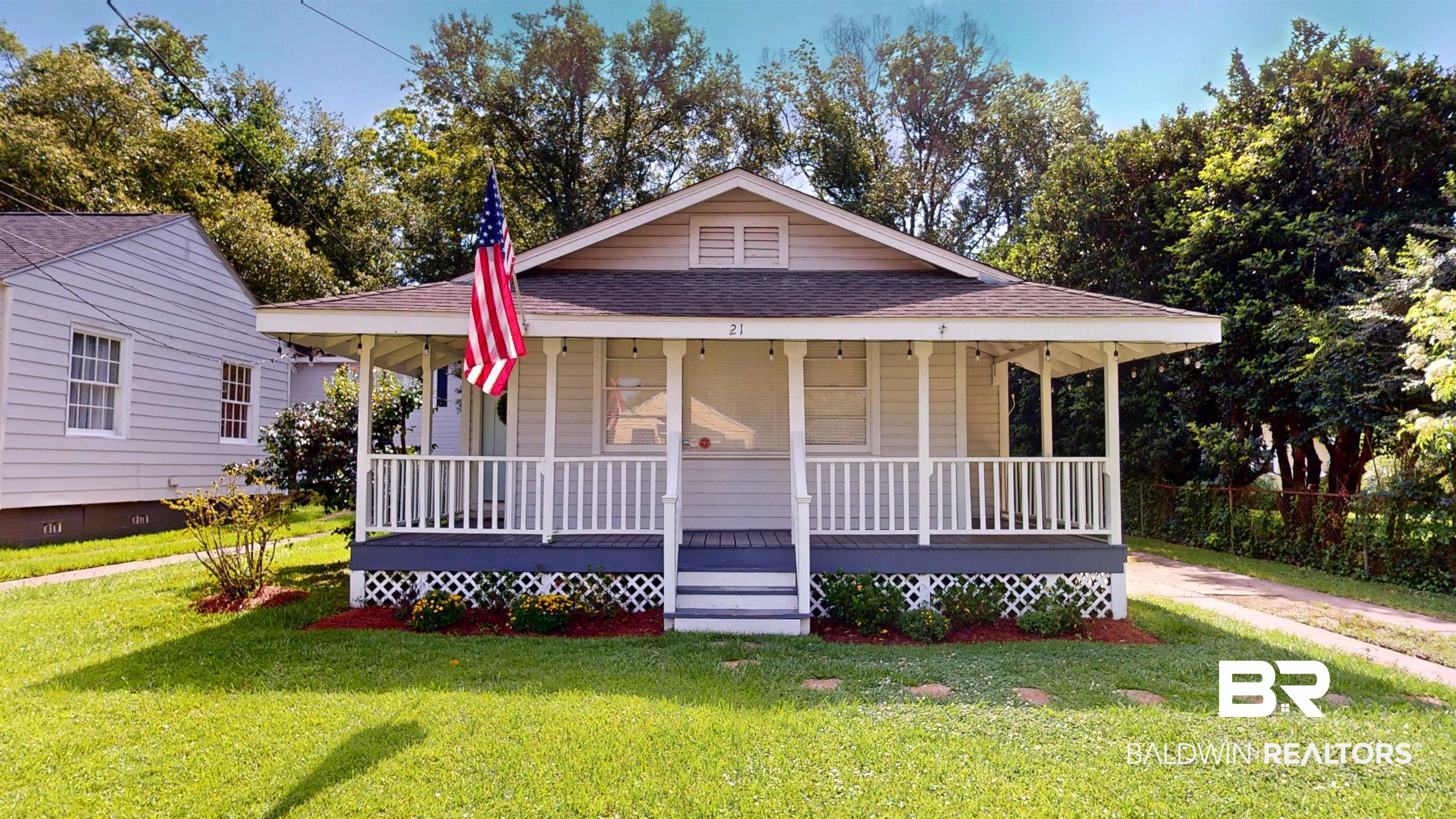 21 Crenshaw Street Mobile, AL 36606 - Photo 1 of 22 View of front of property featuring roof with shingles, a porch, and a front yard