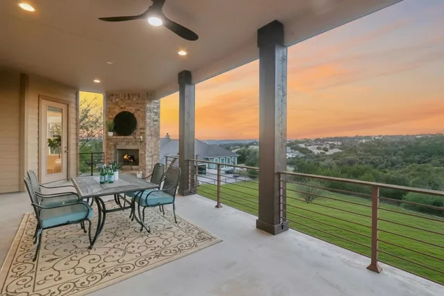 a livingroom with furniture and a floor to ceiling window