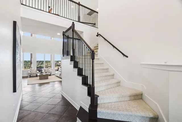 a spacious bathroom with a granite countertop tub sink and mirror