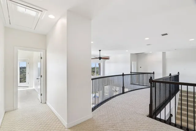 a bathroom with a bathtub and a window