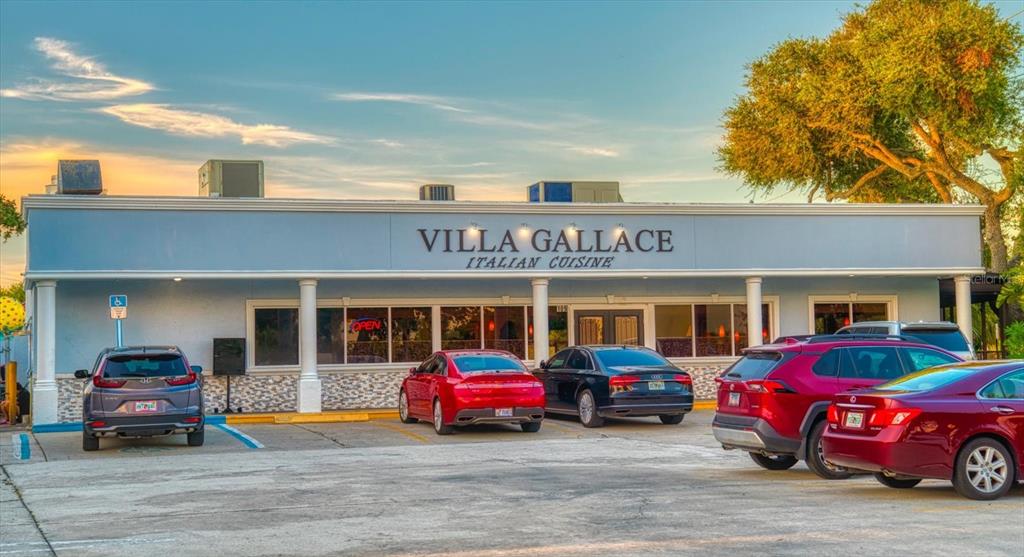 127 11th Avenue Indian Rocks Beach, FL 33785 - Photo 49 of 63 a car parked in front of a building