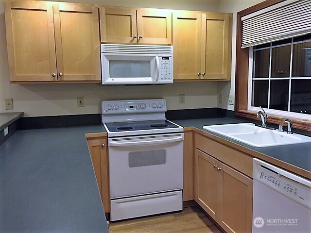 1126 Northwest 56th Street Seattle, WA 98107 - Photo 4 of 8 a utility room with sink dryer and washer