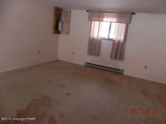 4146 Blueberry Hill Road Bushkill, PA 18324 - Photo 9 of 14 an empty room with windows