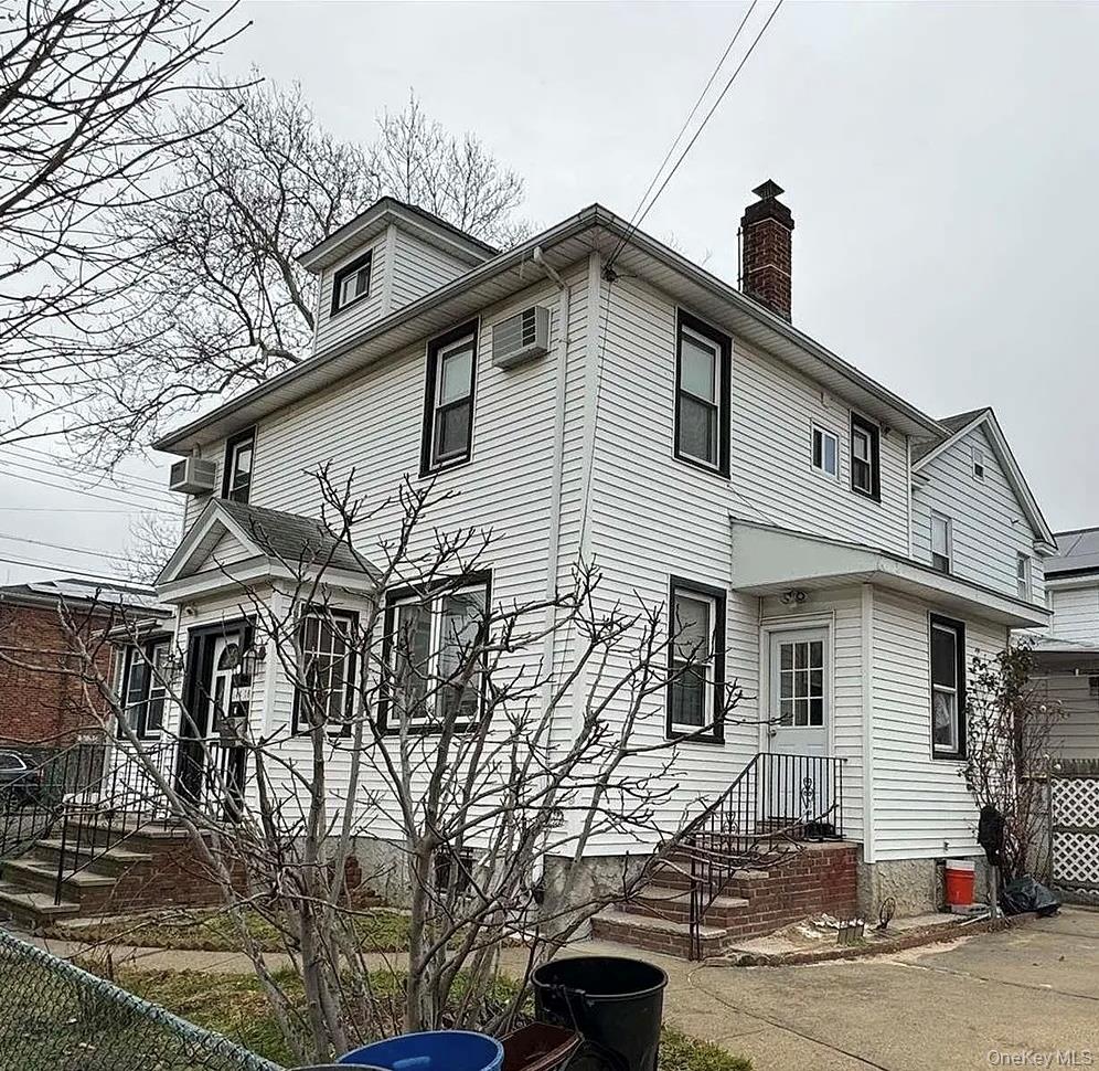 a front view of a house with garage