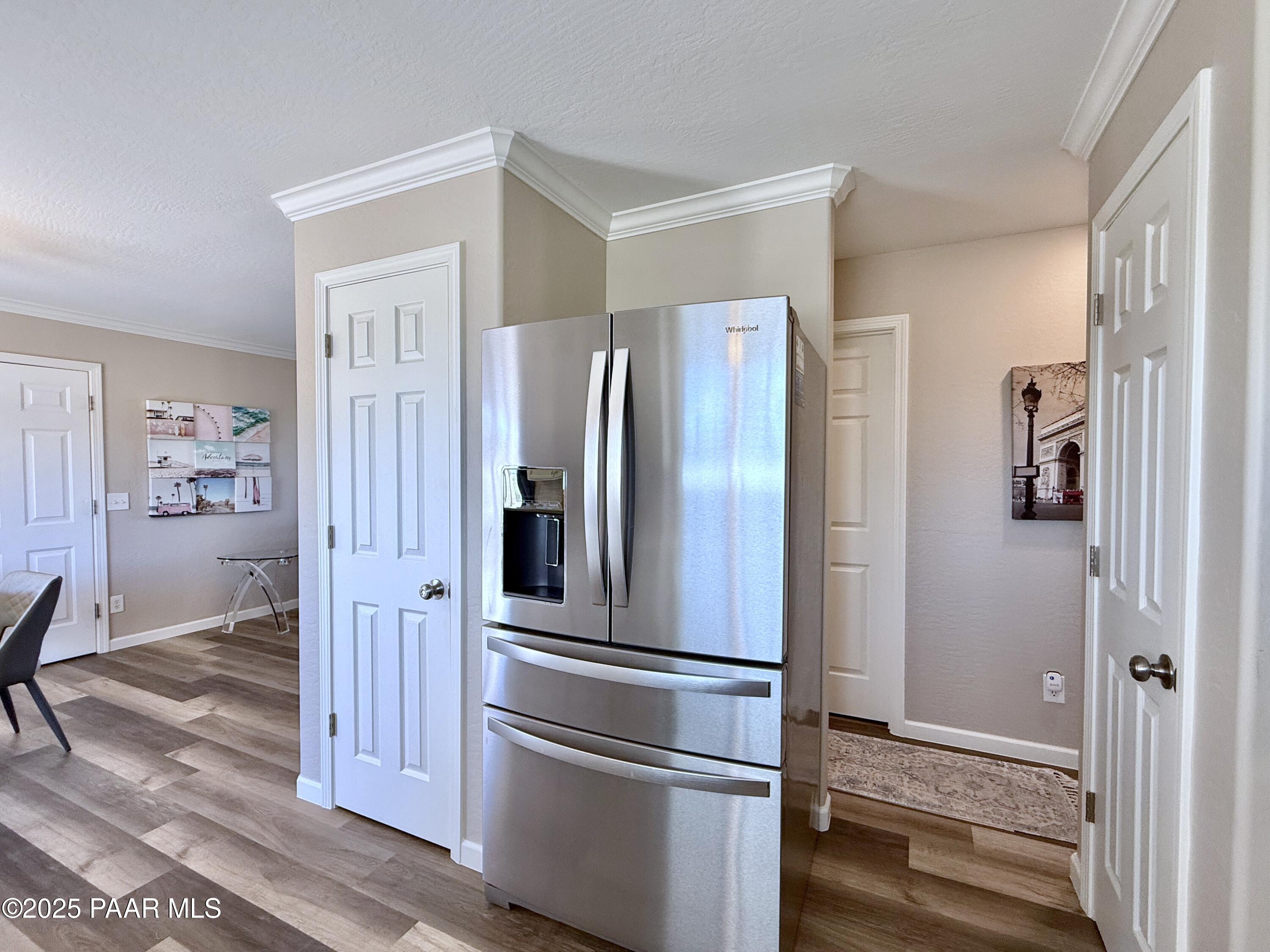 20233 East Sunset Lane Mayer, AZ 86333 - Photo 17 of 42 a metallic refrigerator freezer sitting in a kitchen