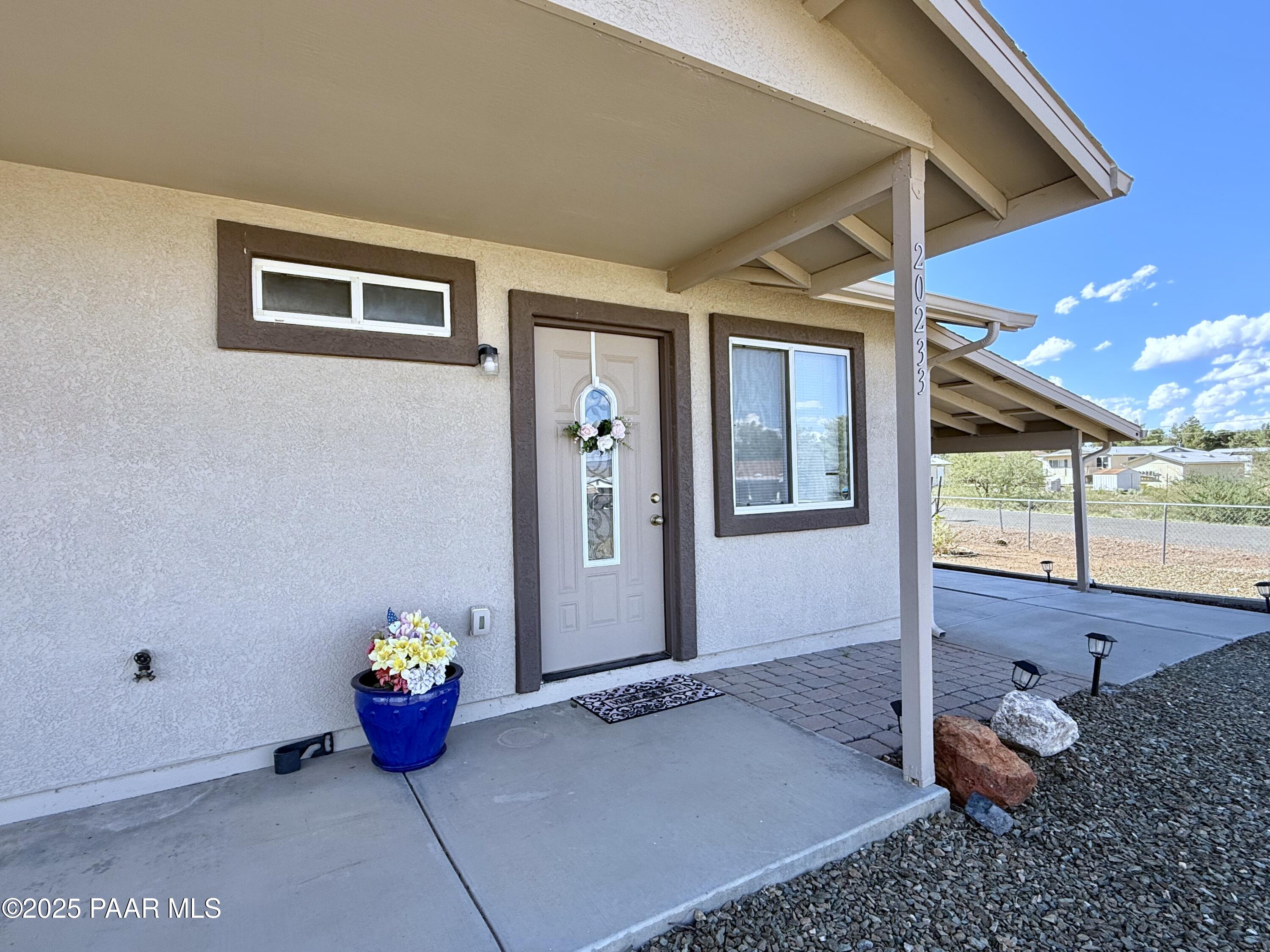 20233 East Sunset Lane Mayer, AZ 86333 - Photo 2 of 42 a outdoor space with a tub and glass door