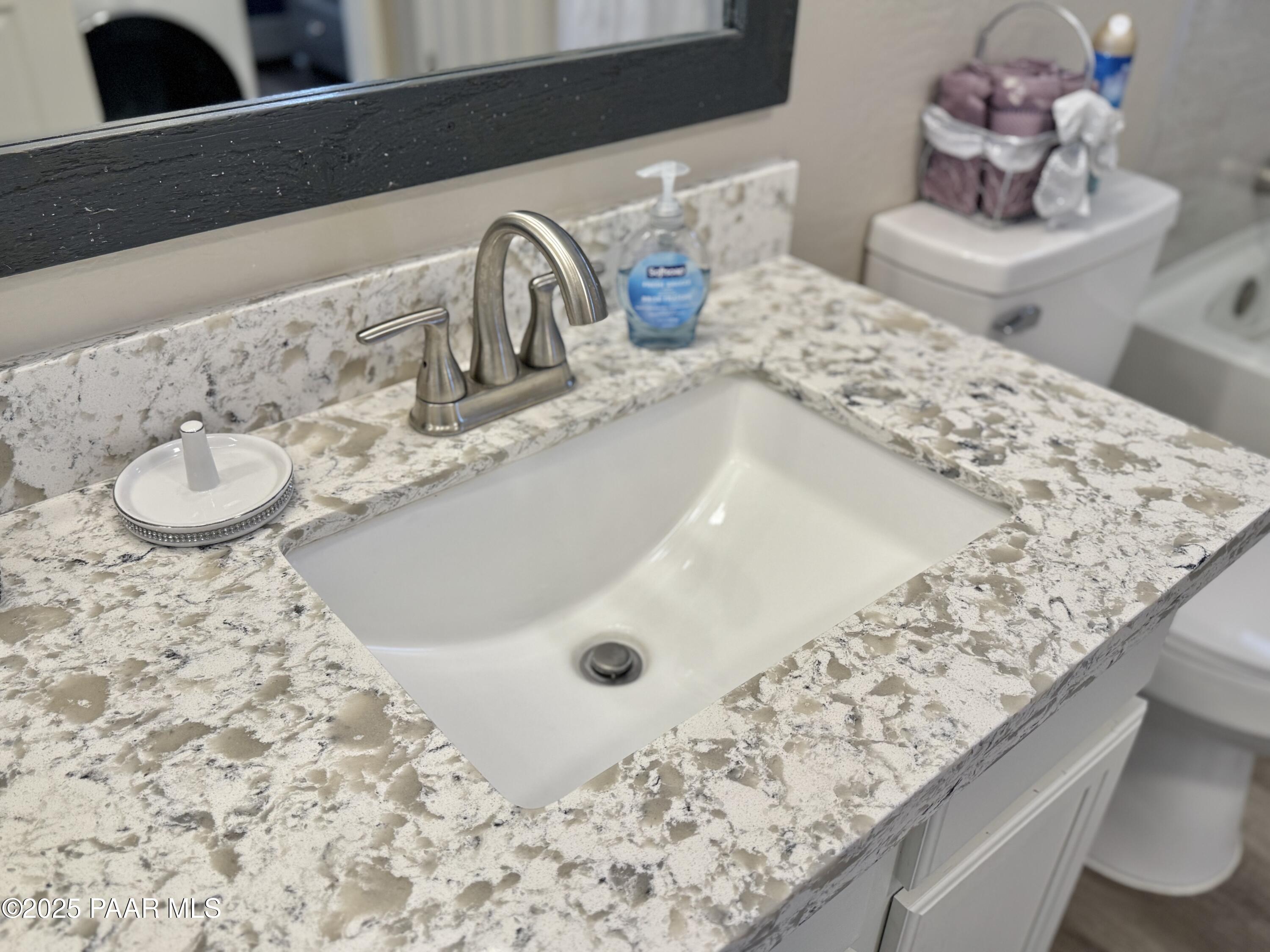 20233 East Sunset Lane Mayer, AZ 86333 - Photo 29 of 42 a bathroom with a granite countertop sink and a mirror