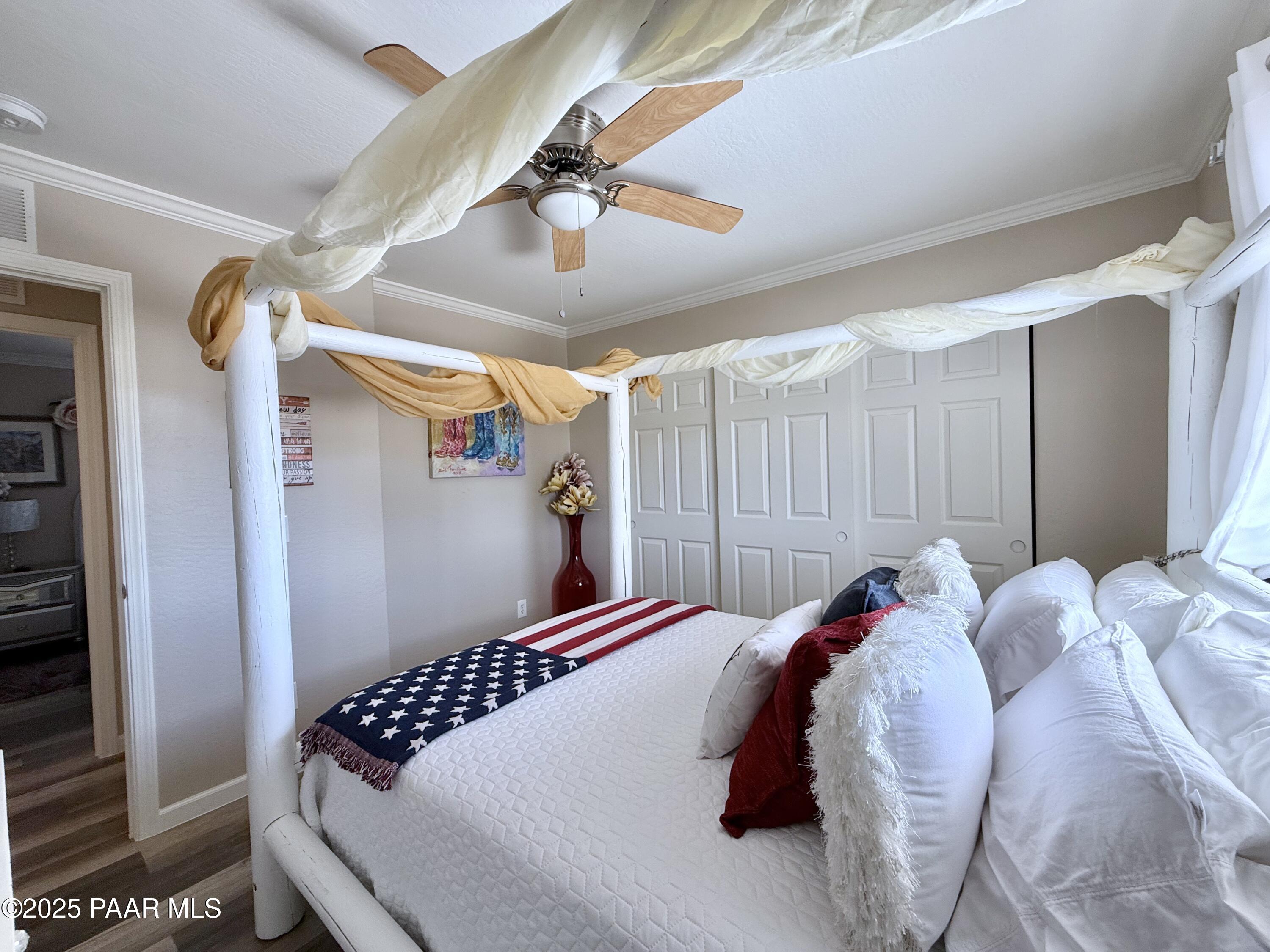 20233 East Sunset Lane Mayer, AZ 86333 - Photo 35 of 42 a bedroom with a bed and a table