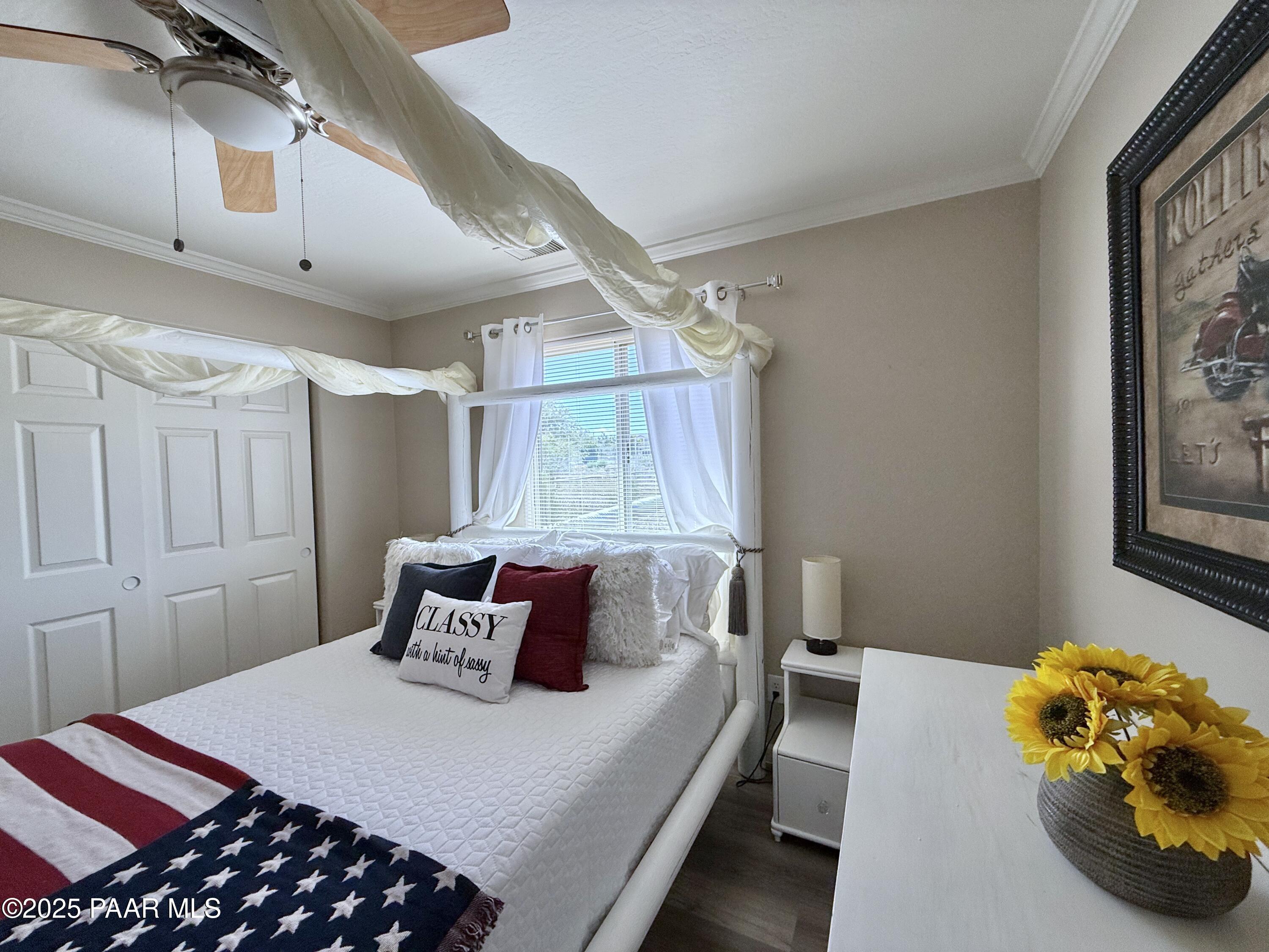 20233 East Sunset Lane Mayer, AZ 86333 - Photo 36 of 42 a bedroom with a bed and window