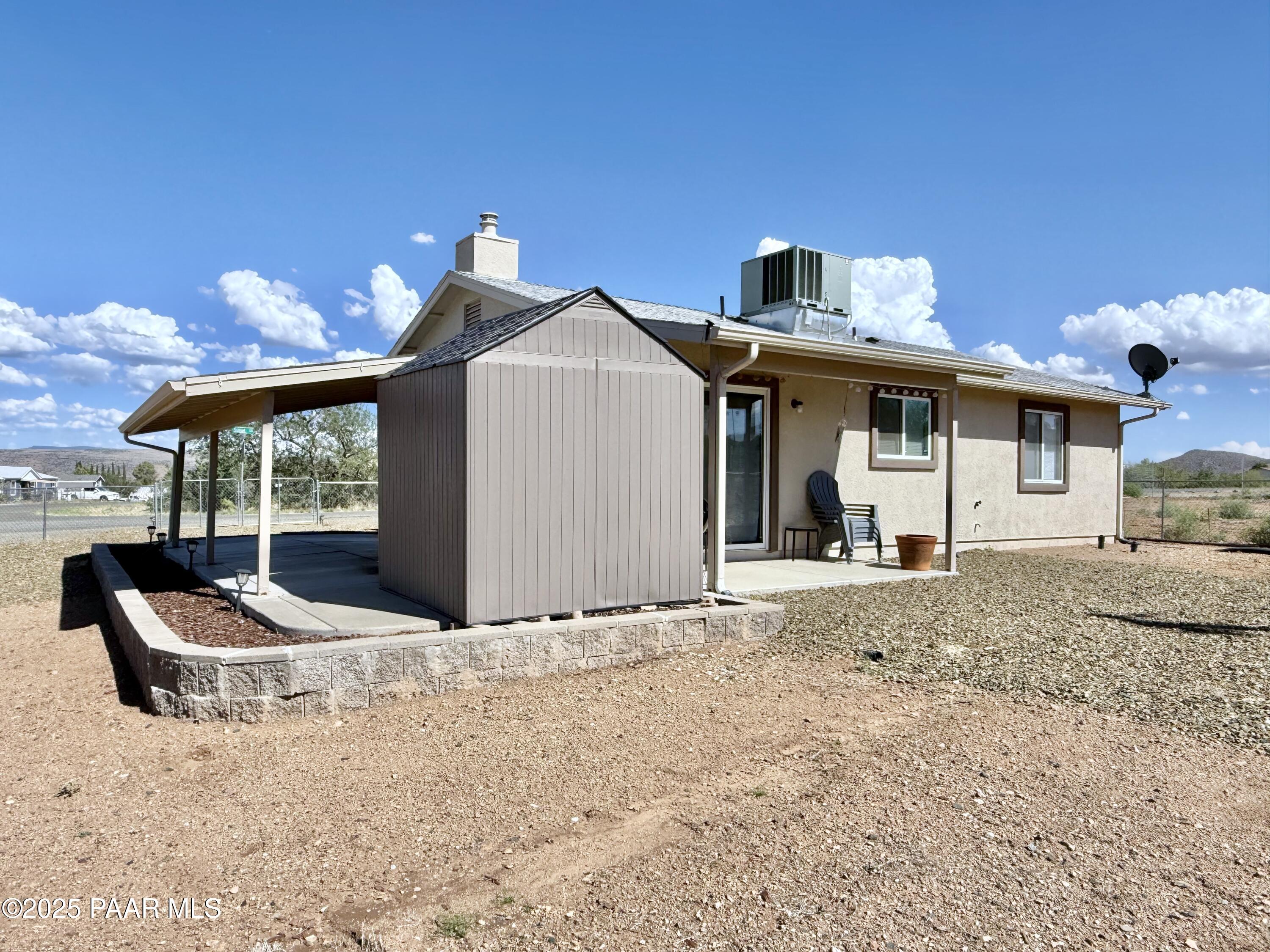 20233 East Sunset Lane Mayer, AZ 86333 - Photo 37 of 42 a front view of a house with garden