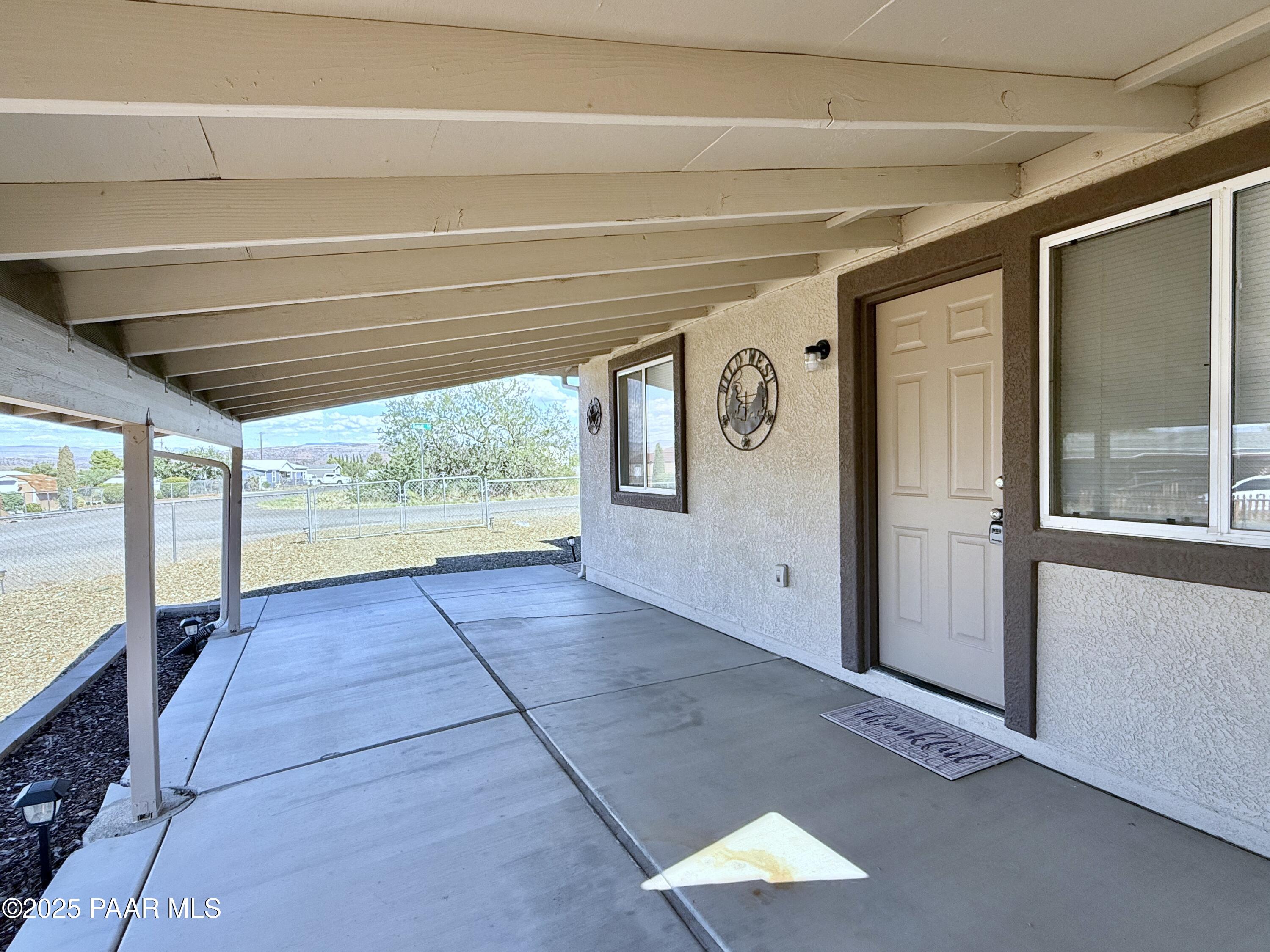 20233 East Sunset Lane Mayer, AZ 86333 - Photo 4 of 42 a view of empty room with large windows