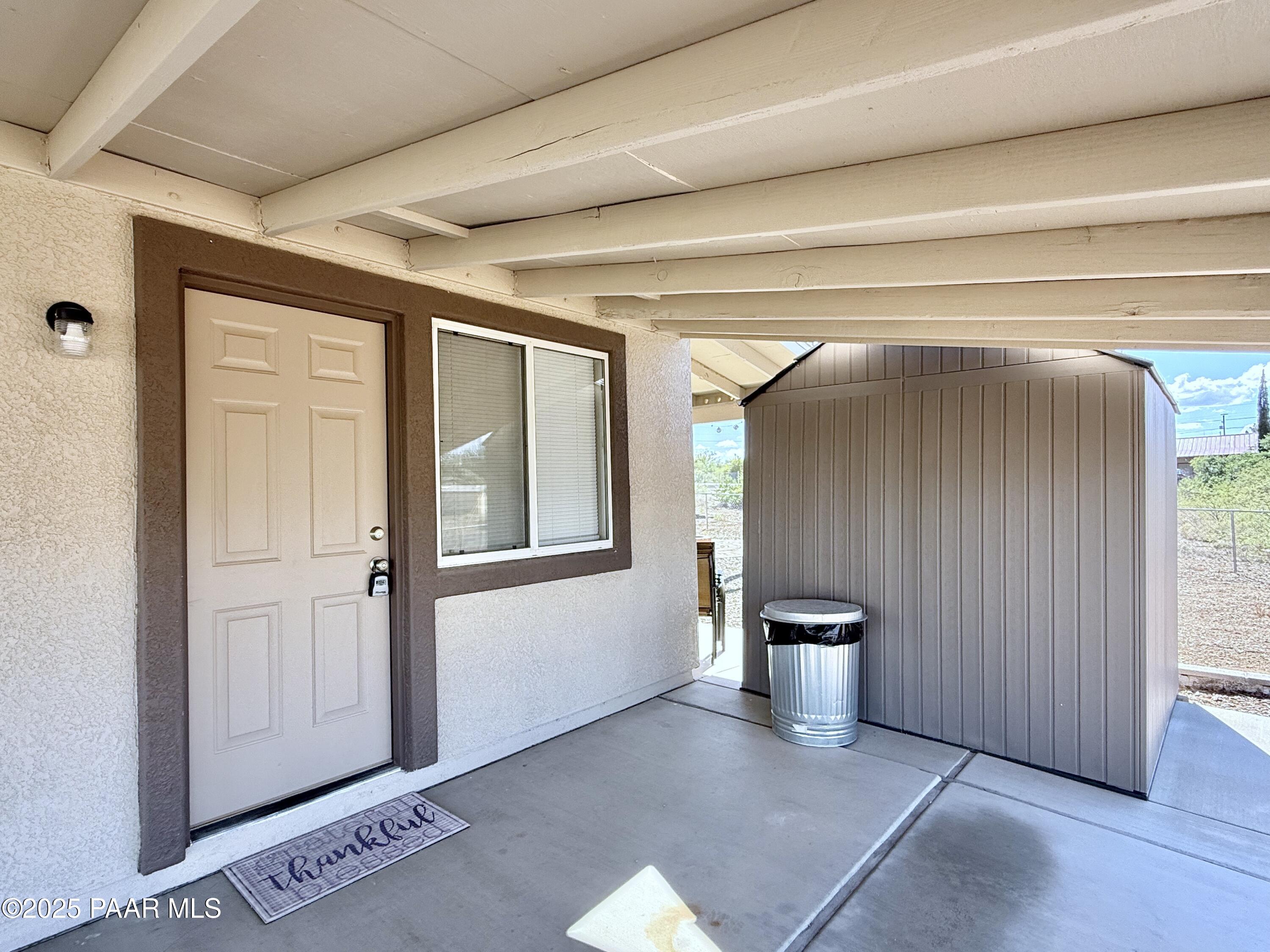 20233 East Sunset Lane Mayer, AZ 86333 - Photo 5 of 42 a view of a big room with wooden floor and windows