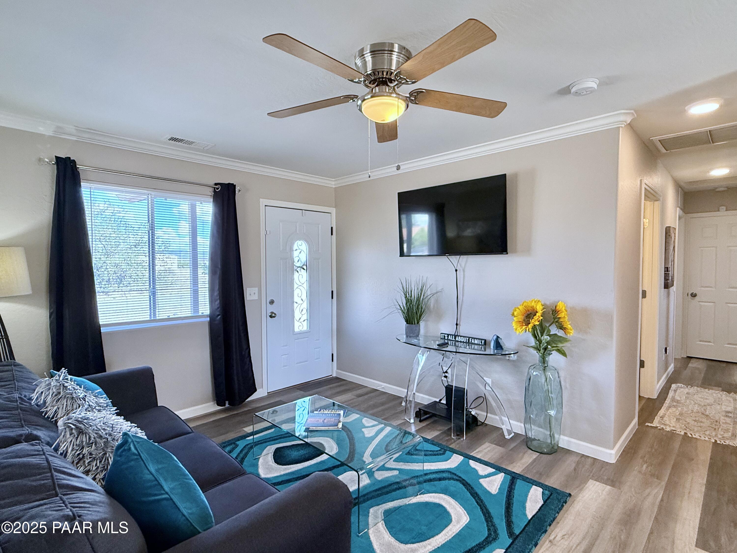 20233 East Sunset Lane Mayer, AZ 86333 - Photo 7 of 42 a living room with furniture and a flat screen tv