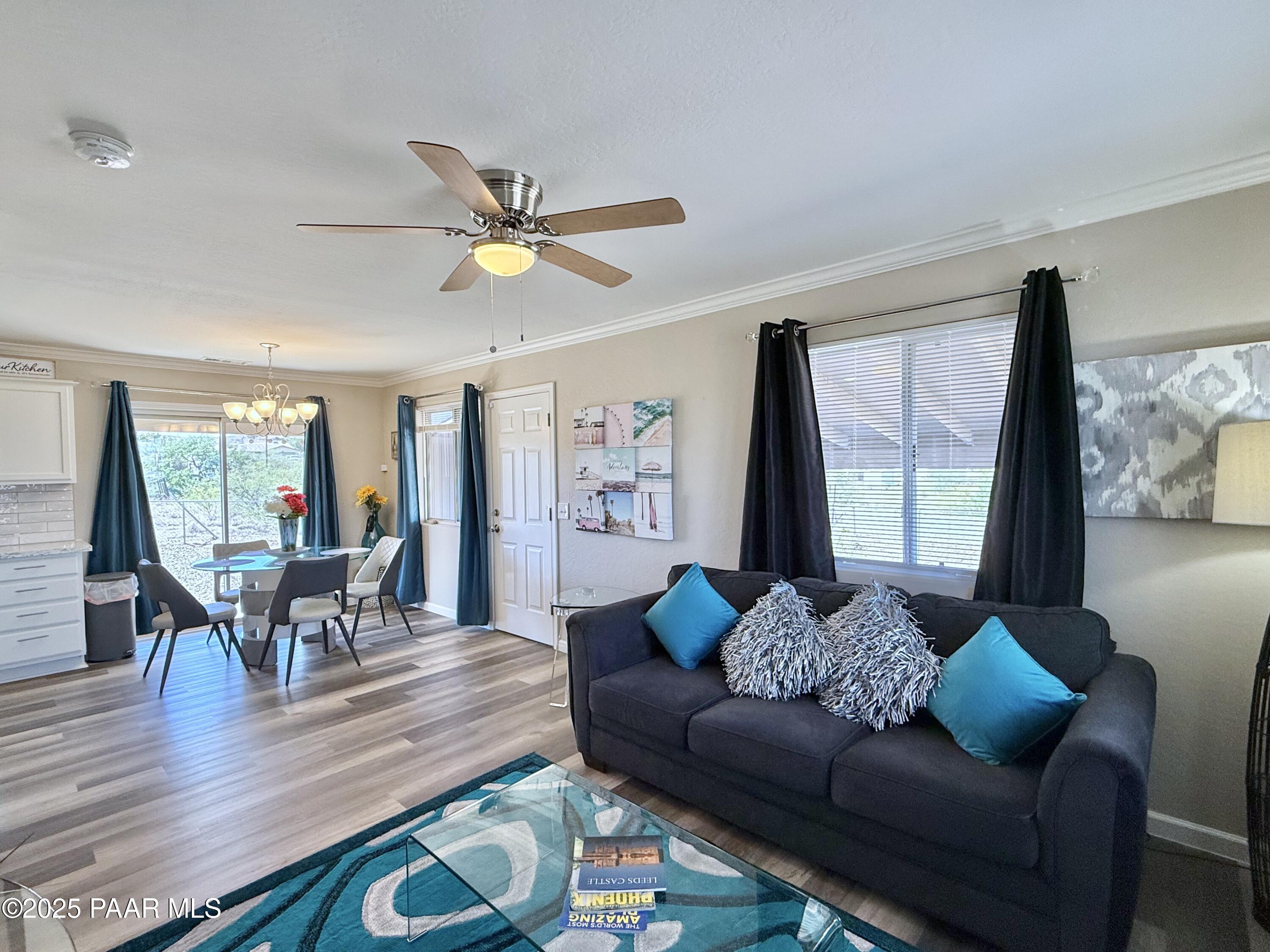 20233 East Sunset Lane Mayer, AZ 86333 - Photo 9 of 42 a living room with furniture and a large window