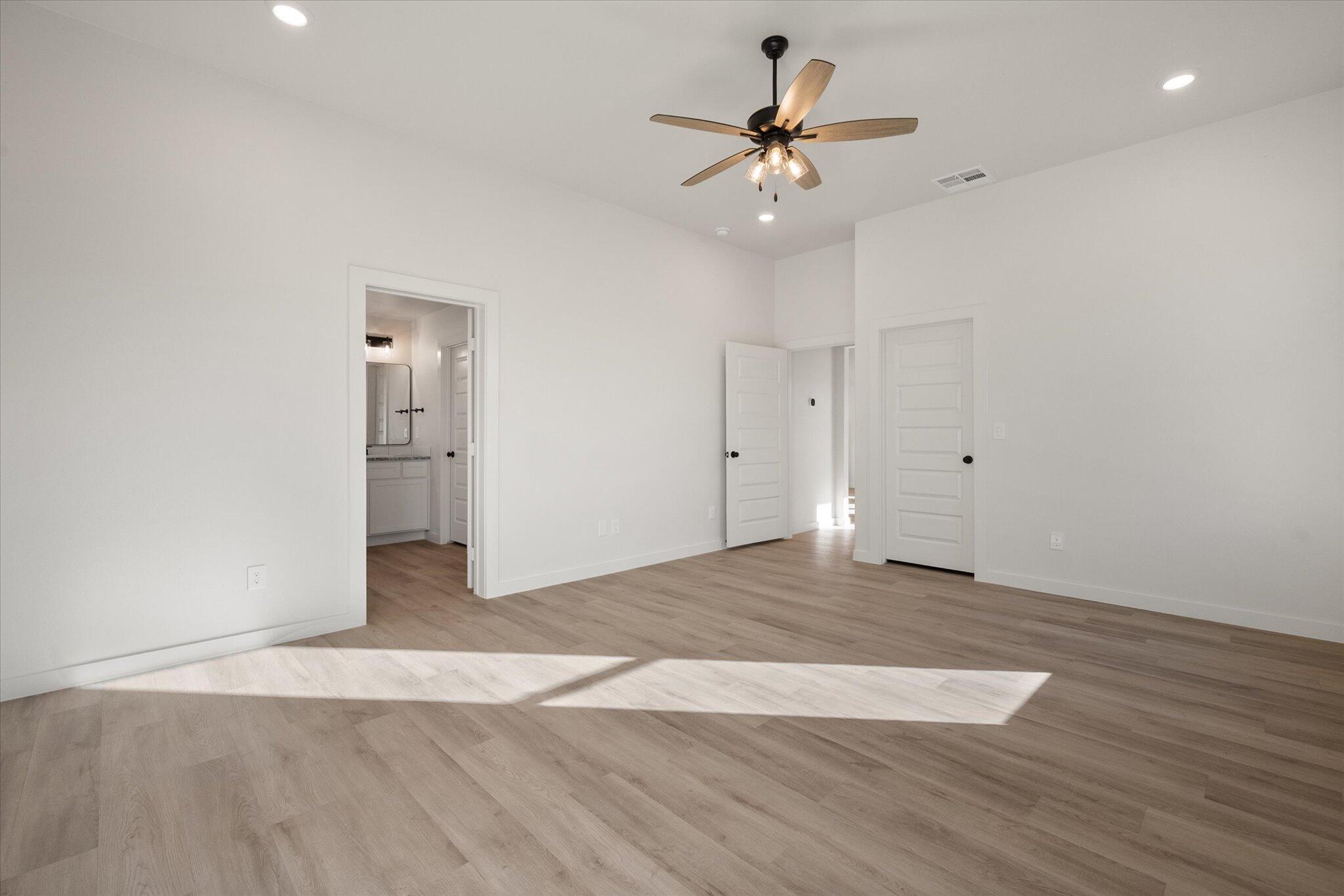 709 East 30th Street Wolfforth, TX 79382 - Photo 15 of 25 a view of an empty room with wooden floor