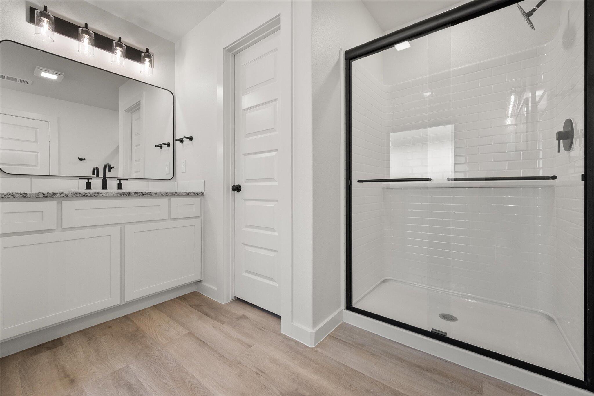 709 East 30th Street Wolfforth, TX 79382 - Photo 16 of 25 a bathroom with a shower