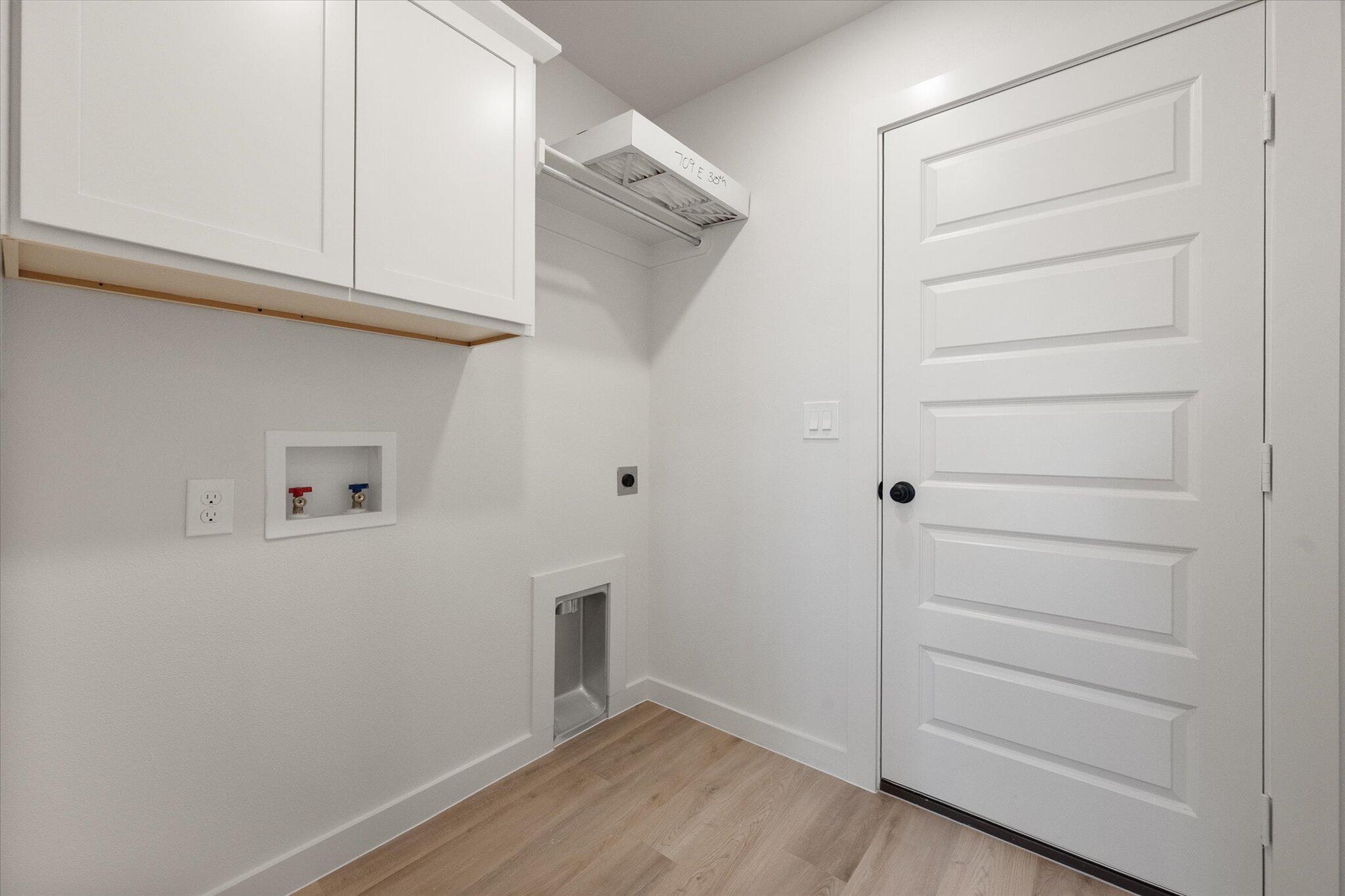 709 East 30th Street Wolfforth, TX 79382 - Photo 23 of 25 a view of an empty walk in closet